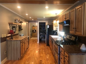 Full kitchen with chef pantry