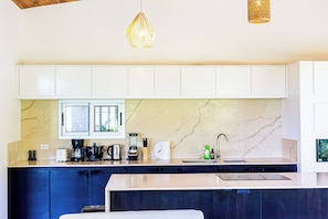 Bright kitchen with neutral tones and plenty of natural light.