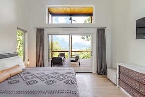 Primary Bedroom with view of Beaver Lake and Private patio door to deck