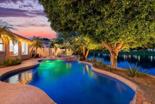 Stunning sunsets and lake views by the shimmering HEATED pool and spa.