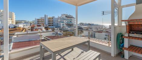 Take in the ocean breeze from this stunning private terrace, complete with a BBQ and seating for al fresco dining. #SeaViewDining #OutdoorLiving