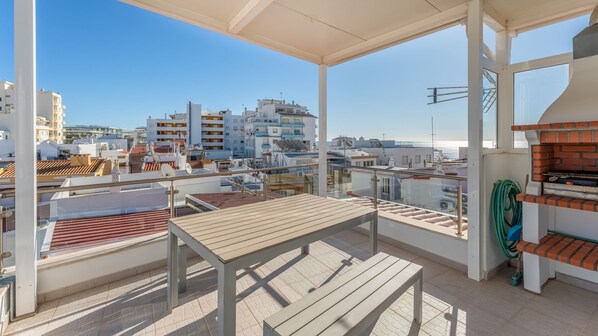 Take in the ocean breeze from this stunning private terrace, complete with a BBQ and seating for al fresco dining. #SeaViewDining #OutdoorLiving