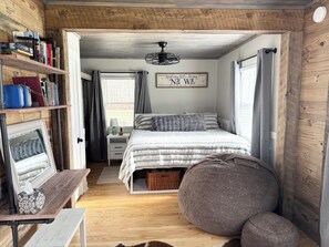 Primary bedroom with workspace and Lovesac seating