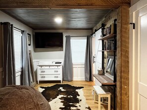 Primary bedroom workspace with clothing storage