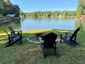 Lake side fire ring and seating while the rest of the party enjoys the lake