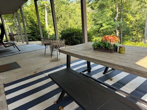 Large outdoor patio for dining with all guests while gazing at the lake.