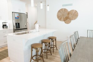 Barstool seating at the kitchen counter.