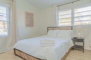 Wake up to natural light in this bright and airy bedroom. Crisp white linens and a clean, minimalist design create a refreshing and relaxing atmosphere. #brightbedroom #cleanliving #minimalistdesign #airbnb

