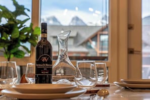 Gather around the elegant dining table and enjoy delectable meals with a view