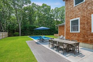 Relax poolside under the sun at your private oasis.