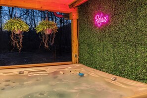 Unwind in the hot tub as you soak in the peaceful, secluded views all around you