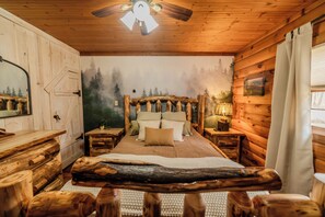 Queen-size bed conveniently located on main floor for easy access and comfort.