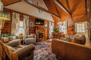 Cozy up on the plush sofa by the warm glow of the fireplace while enjoying TV!