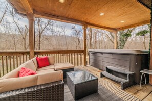 Enjoy hot tub in our secluded backyard with peaceful sounds of the flowing creek