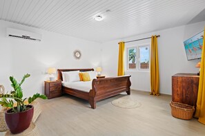 Bedroom 1 features a king size bed