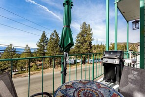 Private balcony with a grill, perfect for outdoor dining with a view.