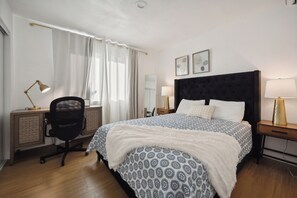Work and relax in this cozy bedroom with a dedicated workspace!