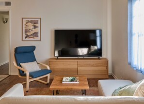 80” TV with couch and chair