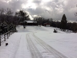 Driveway to house in winter, 6 in snow. 4x4 required or park at top. 

