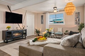 Cozy up by the fireplace in this inviting living room.