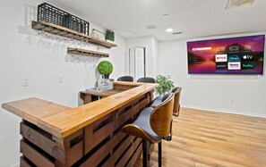 Wet bar and big screen TV in the downstairs games room