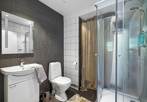 Bathroom with shower. Washing machine and tumble dryer available in building next door