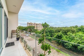 Let the fresh air and stunning views from this balcony set the tone for your stay.