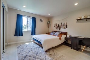 Recharge in this cloud-like queen bed in Bedroom 2 w/ a nearby workspace