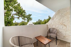 Enjoy stunning views and fresh air on this cozy balcony, perfect for relaxing.