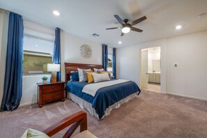 Main house: Primary suite's comfortable king-size bed with plenty of cozy pillows