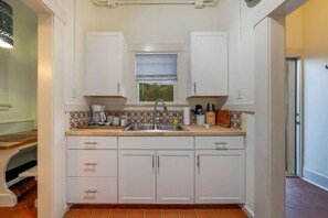 Casita #2: Kitchen sink with counters and cabinets stocked for your stay