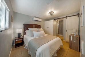 CASITA: Bedroom with queen bed, storage, and mini split AC unit to ensure your comfort