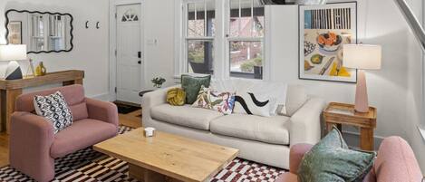 Entering the house, you walk into our eclectic living room. Put your things off to the side on the table, hang your coats on the hook and relax!