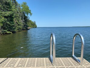 Floating dock with ladder for swimming