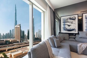 Unwind in a cozy living room overlooking the iconic Burj Khalifa.