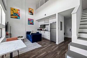 Living area and staircase to loft