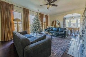 "Step into a space with character! This living room boasts beautiful architectural details, from the exposed brick to the elegant display fireplace. A perfect blend of classic and contemporary design."


