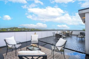 Rooftop Deck: Enjoy outdoor living on this expansive rooftop patio, perfect for entertaining or relaxing under the open sky.