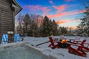 Soak away in our 6-person 100 jet hot tub under the night sky