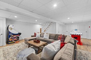 Have fun in our basement game room featuring Arcade Legends 3 with Golden Tee, Super Chexx bubble hockey, a 75" Samsung smart TV and lots of board games for kids and adults