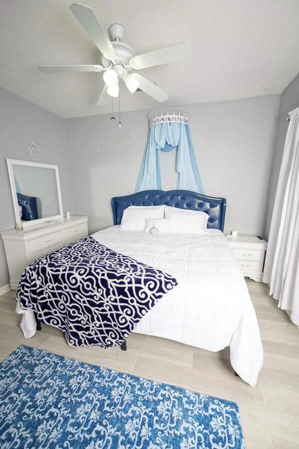 This Princess Suite is love. This room includes mirrored vanity with drawer space, along with a closet which houses an iron and ironing board (No mice included to assist you, we apologize).