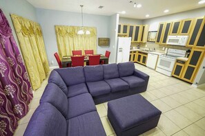 Only beauty, no beast in this comfortable open living room. The couch seats 6 comfortably, and can easily be turned into a cozy movie watching spot with the ottoman.