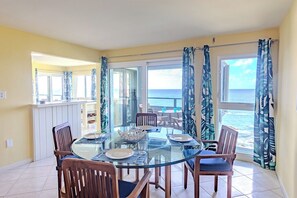 Natural lighting and a beautiful view accompany the inside dining area. 