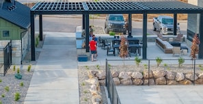 Outdoor seating for all guests at tables or by the gas fireplace.