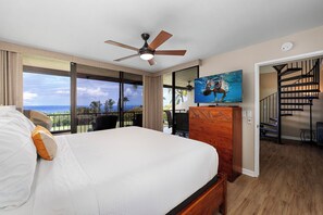 Primary bedroom: King bed, ensuite bathroom with a shower, TV, and air conditioning