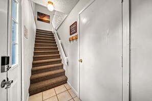 Ascend to your beach getaway from the ground floor entrance for Driftwood