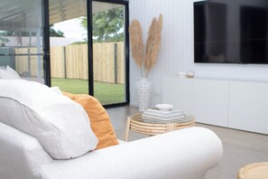 Seamless integration from the living room to the patio and spacious yard.