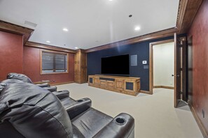 Movie theater: Lower level, 8 reclining chairs, sound system