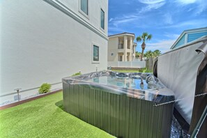 Indulge in ultimate relaxation with a private hot tub oasis, perfect for unwinding after a day at the beach