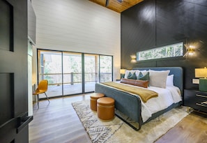 This stylish king bedroom blends comfort and natural light, creating a serene retreat to unwind and recharge.